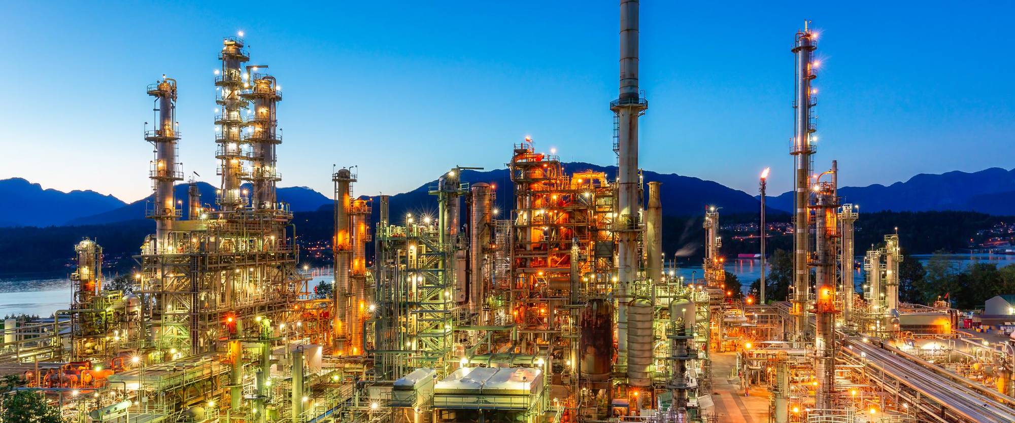 A process plant lit up at dusk, the kind of operating plant VB Engineering works on