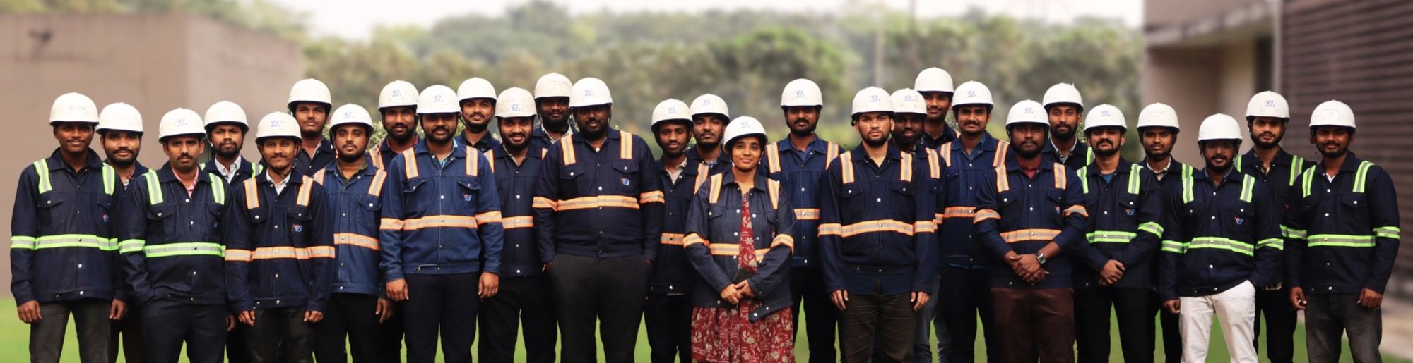 The VB Engineering team in navy uniforms and white hard hats