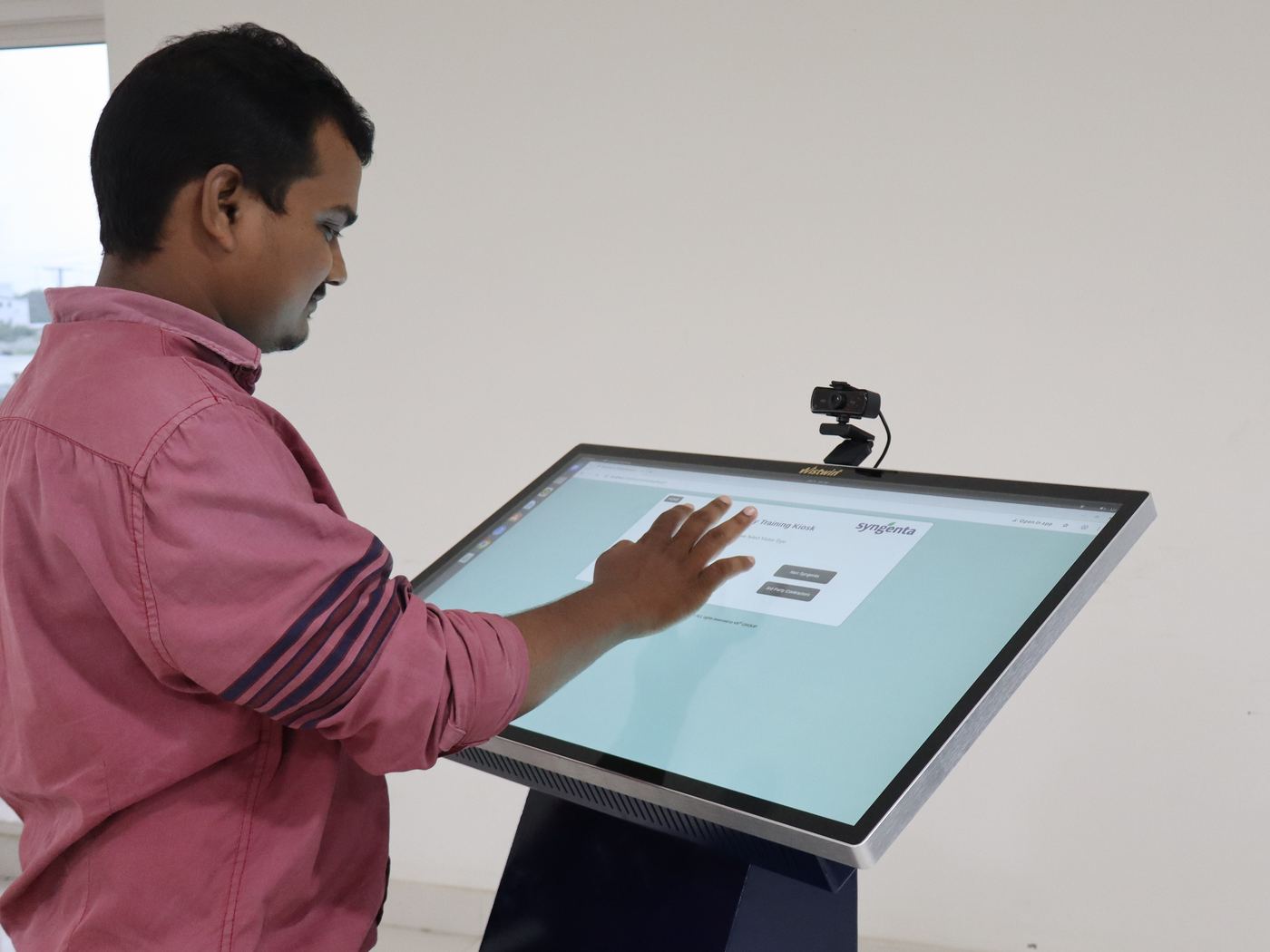 An engineer using the Wistwin touchscreen kiosk