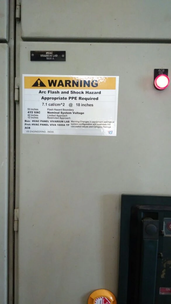 Engineered VB warning label installed on HVAC VIVARIUM LAB 1600A panel · 7.1 cal per cm squared with arc flash + shock boundary + bus + protection · real field close-up